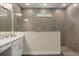 This bathroom features a spacious walk-in shower with sleek gray tiles and modern fixtures at 1103 Silo Dr, St Cloud, FL 34771