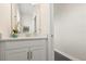 Bright bathroom features a white vanity with modern fixtures and decor at 1103 Silo Dr, St Cloud, FL 34771