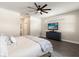 Comfortable bedroom with ceiling fan, accent wall, and hardwood flooring at 1103 Silo Dr, St Cloud, FL 34771