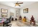 Comfortable bedroom featuring warm lighting, decorative artwork, and hardwood-style floors at 1103 Silo Dr, St Cloud, FL 34771