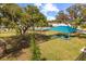 Community picnic area with shade, picnic tables, and mature trees for outdoor relaxation at 1103 Silo Dr, St Cloud, FL 34771