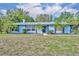 Charming one-story home with a well-maintained lawn and tropical landscaping at 1111 Lynx Trl, Winter Springs, FL 32708