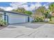 Home featuring an attached garage, long driveway, and a neutral color scheme at 1111 Lynx Trl, Winter Springs, FL 32708