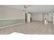 Open living room with tile floor, neutral paint, decorative wainscoting, and views to the front yard at 1111 Lynx Trl, Winter Springs, FL 32708