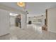 View from living room into kitchen with stainless appliances at 1111 Lynx Trl, Winter Springs, FL 32708