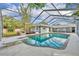 Screened-in pool with blue water and diving board, perfect for backyard entertainment at 1111 Lynx Trl, Winter Springs, FL 32708