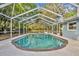 Inviting screened-in pool area, perfect for relaxation and outdoor enjoyment at 1111 Lynx Trl, Winter Springs, FL 32708
