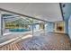 Spacious brick patio and screened-in pool area, great for entertaining and lounging at 1111 Lynx Trl, Winter Springs, FL 32708