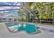 Screened in outdoor pool and patio with diving board surrounded by trees at 1111 Lynx Trl, Winter Springs, FL 32708
