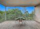 Relaxing balcony space with seating and beautiful tree views at 1150 Carmel Cir # 301, Casselberry, FL 32707