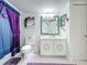 Charming bathroom featuring decorative vanity and vibrant decor at 1150 Carmel Cir # 301, Casselberry, FL 32707