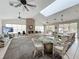 Clubhouse interior with large skylight, fireplace, seating, and views of the pool at 1150 Carmel Cir # 301, Casselberry, FL 32707