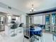 Inviting dining space with barstool seating at the kitchen island and a built-in display cabinet with bench at 1150 Carmel Cir # 301, Casselberry, FL 32707