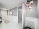 Well-lit hallway with decorative lighting and a stylish accent rug at 1150 Carmel Cir # 301, Casselberry, FL 32707