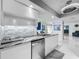 Contemporary kitchen showcasing granite countertops, white cabinets, and stainless steel appliances, including a dishwasher at 1150 Carmel Cir # 301, Casselberry, FL 32707