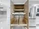Spacious pantry with pull out shelves, drawers and a stainless steel refrigerator next to the kitchen at 1150 Carmel Cir # 301, Casselberry, FL 32707