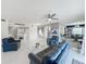 Open-concept living room with contemporary furnishings and seamless transition to dining area at 1150 Carmel Cir # 301, Casselberry, FL 32707