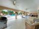 Pool area with covered patio and outdoor grill at 1150 Carmel Cir # 301, Casselberry, FL 32707
