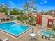 Inviting community pool and spa area with lounge chairs and well-maintained landscaping at 1150 Carmel Cir # 301, Casselberry, FL 32707