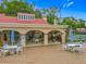 Community clubhouse with outdoor seating, BBQ and tennis courts at 1150 Carmel Cir # 301, Casselberry, FL 32707