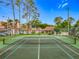 Community tennis court surrounded by lush landscaping at 1150 Carmel Cir # 301, Casselberry, FL 32707