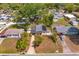 Aerial view of the property showing the house, yard with green borders, and neighborhood at 1219 Helen St, Apopka, FL 32703