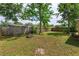 Large, fenced backyard with a tree, offering a private outdoor space at 1219 Helen St, Apopka, FL 32703