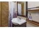 This bathroom features a decorative sink, shelves and neutral earth tone tile at 1219 Helen St, Apopka, FL 32703