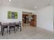 Open dining area next to kitchen with tile floors, lots of light and open access at 1219 Helen St, Apopka, FL 32703