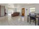 Spacious living room with tile flooring, dining table and bright natural light at 1219 Helen St, Apopka, FL 32703