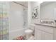 Bright bathroom with white tiles, granite countertop, and modern fixtures at 1266 Limbali St, Mount Dora, FL 32757