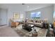 Cozy living room with neutral tones, a large window, and comfortable seating at 1266 Limbali St, Mount Dora, FL 32757