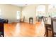 Bright dining area with hardwood flooring featuring open archways and natural light at 14720 Sweet Acacia Dr, Orlando, FL 32828