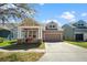 Lovely single-Gathering home with a manicured lawn and a convenient two-car garage on a sunny day at 14720 Sweet Acacia Dr, Orlando, FL 32828
