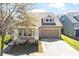 Cozy single-Gathering home boasting a well-kept lawn and an attached two-car garage on a bright day at 14720 Sweet Acacia Dr, Orlando, FL 32828