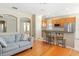 Cozy living area adjacent to the kitchen, featuring a breakfast bar and comfortable seating at 14720 Sweet Acacia Dr, Orlando, FL 32828