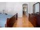 Spacious main bedroom with hardwood floors, soft lighting, and plenty of closet space for clothing and storage at 14720 Sweet Acacia Dr, Orlando, FL 32828