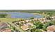 Gorgeous aerial view of the neighborhood, highlighting lake view lots and verdant landscaping throughout the community at 1558 Terra Verde Way, Ocoee, FL 34761