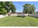 Spacious backyard with green grass and full privacy fence at 1558 Terra Verde Way, Ocoee, FL 34761