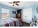 Comfortable bedroom with closet, natural lighting, and ceiling fan at 1558 Terra Verde Way, Ocoee, FL 34761