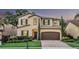 Charming two-story home featuring manicured landscaping, a brick driveway, and a two-car garage at 1558 Terra Verde Way, Ocoee, FL 34761