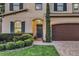 Inviting front entrance with brick path, manicured landscaping, and a view of interior window at 1558 Terra Verde Way, Ocoee, FL 34761