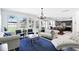 Bright open-concept living room with neutral decor and large windows offering scenic views at 1558 Terra Verde Way, Ocoee, FL 34761