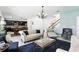 Bright living room featuring tile floors, a modern chandelier, and an open floor plan flowing into the kitchen at 1558 Terra Verde Way, Ocoee, FL 34761
