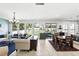 Spacious living room area featuring plenty of natural light, tile floors, and open-concept layout at 1558 Terra Verde Way, Ocoee, FL 34761