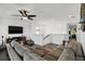 Upstairs loft space with wood floors, comfortable seating, and a mounted television for entertainment at 1558 Terra Verde Way, Ocoee, FL 34761