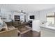 Cozy upstairs loft area with hardwood floors, comfortable seating, and natural light from nearby windows at 1558 Terra Verde Way, Ocoee, FL 34761