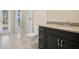 Modern bathroom with glass shower and black vanity at 15698 Marina Bay Dr, Winter Garden, FL 34787