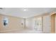 Airy bedroom with large windows and a sliding door for ample natural light and backyard views at 15698 Marina Bay Dr, Winter Garden, FL 34787