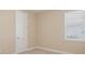Neutral bedroom with carpet, cream walls and window at 15698 Marina Bay Dr, Winter Garden, FL 34787